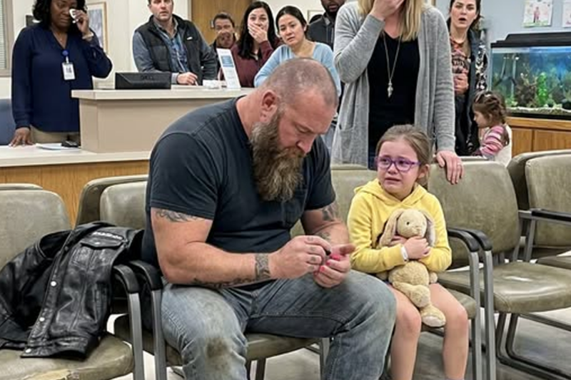 PART 2 The waiting room stayed frozen for a long beat after Tank’s words. Then, slowly, the spell broke. Maddie’s small hands steadied as she brushed red polish across her father’s big toe. The stroke was wobbly, but Tank held perfectly still, as if the tile floor were made of glass.